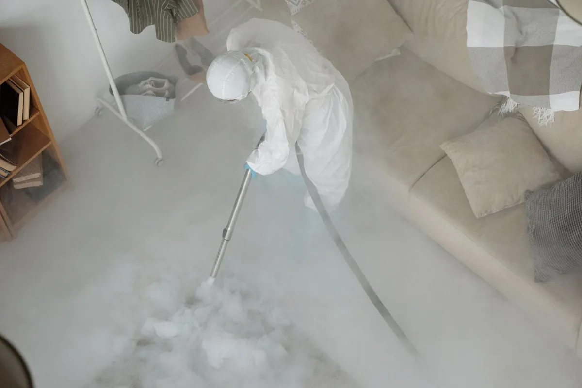 Biohazard cleanup technician in protective equipment, Downtown, San Antonio, TX